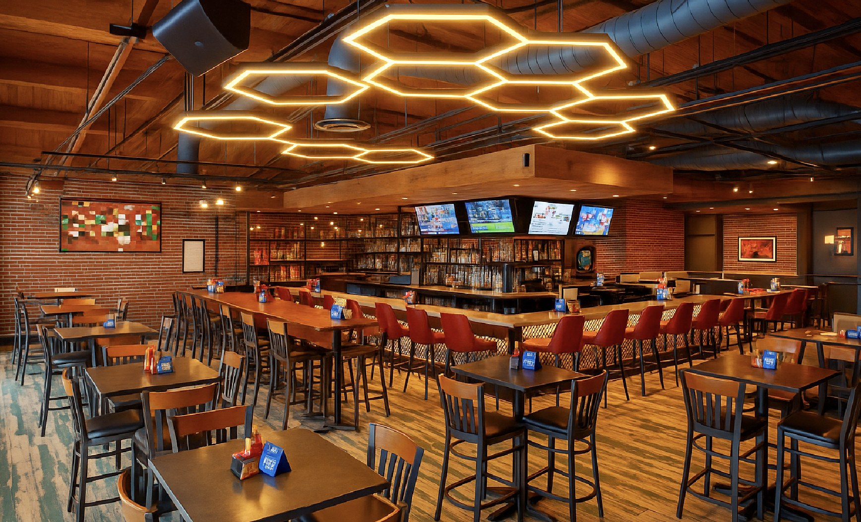 BuzzSocial dining room, with honeycomb LED fixtures over the bar and tables
