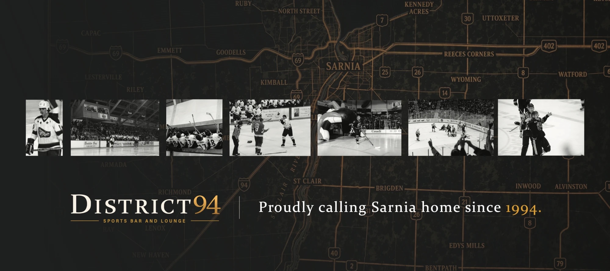 The District 94 graphic wall: a dark map of Sarnia, a row of black-and-white hockey photos, the District 94 logo and the line “Proudly calling Sarnia home since 1994.”